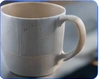 Marketing illustration of a mug, not actual inspection evidence